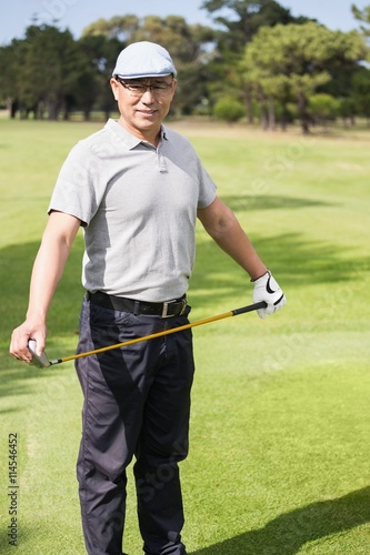 Portrait of golfer holding his golf club