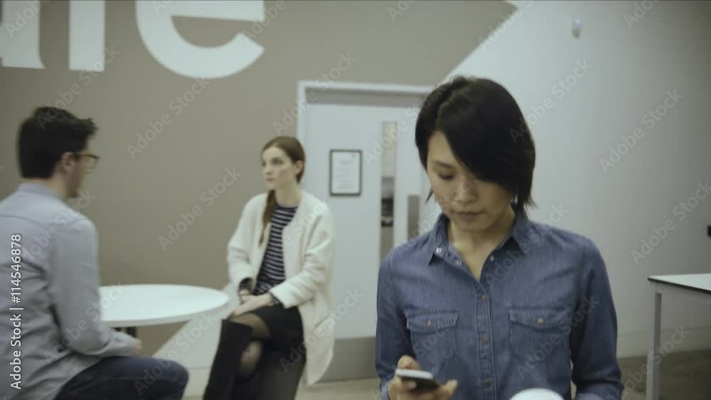 Man using digital tablet and discussing with woman in office café Man using digital tablet and discussing with woman in office café