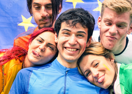 Картината върху платно Funny faces group of friends taking selfie at football stadium - International s