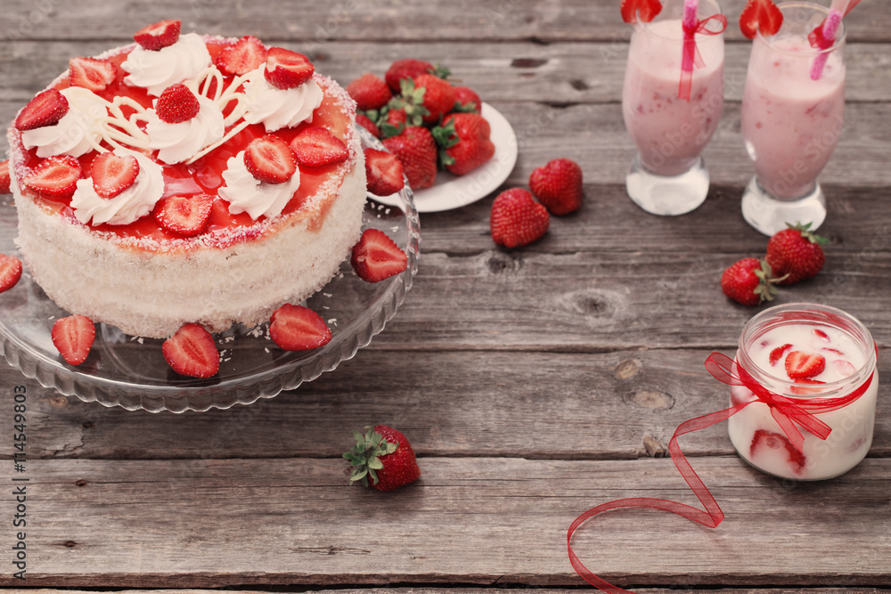cake with strawberries on wooden table
