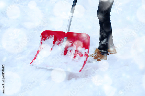 Man removing snow with a snow shovel. Snow effect