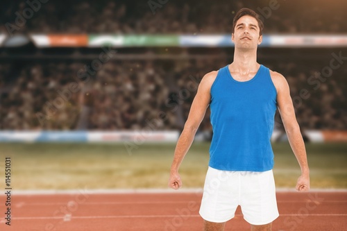 Composite image of male athlete standing on white background © vectorfusionart