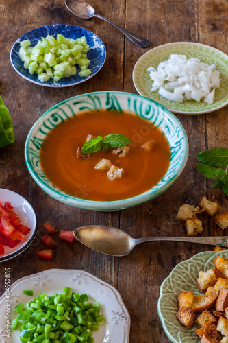 Gazpacho Spanish cold summer soup prepared the authentic way with garnishes served separately.