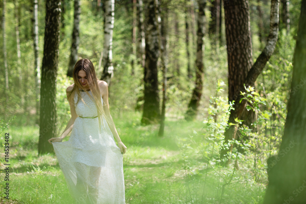 portrait of young woman in the forest