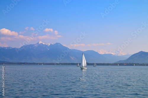 Walk on a yacht on mountain lake.