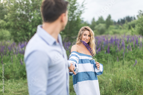 happy young couple man and woman walking in nature, concept of l