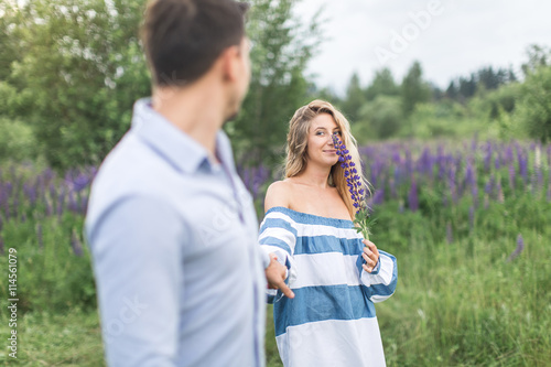 happy young couple man and woman walking in nature, concept of l