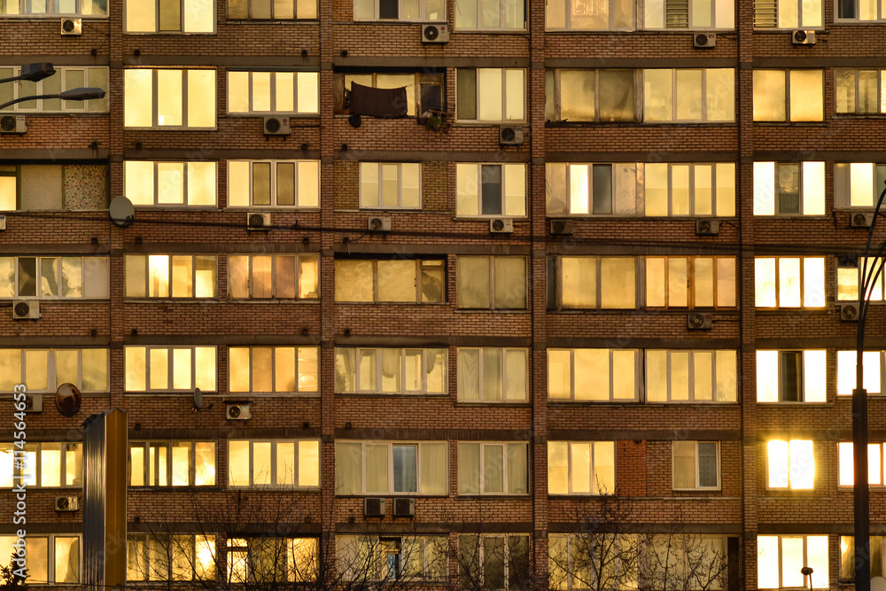 Building with golden windows background Building with golden windows background