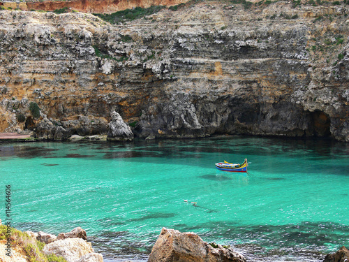 small fisherman's boat in a wonderful bay Gozo Malta
