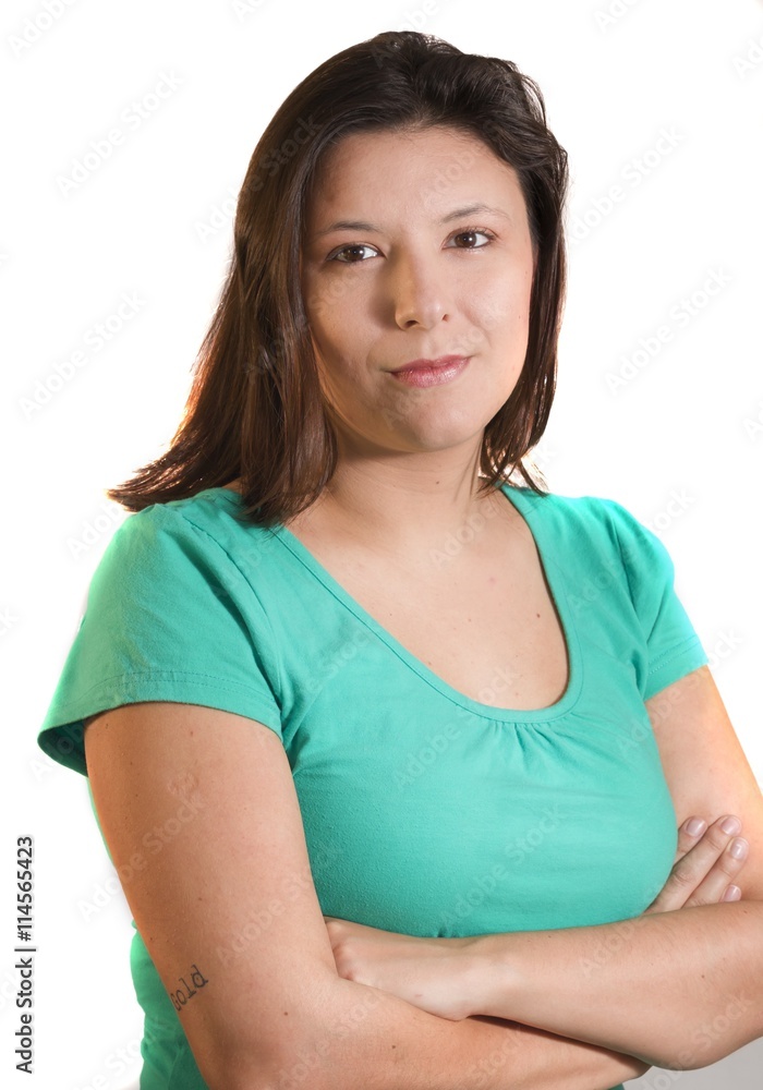 young and beautiful Brazilian girl with crossed arms and serious face young and beautiful Brazilian girl with crossed arms and serious face