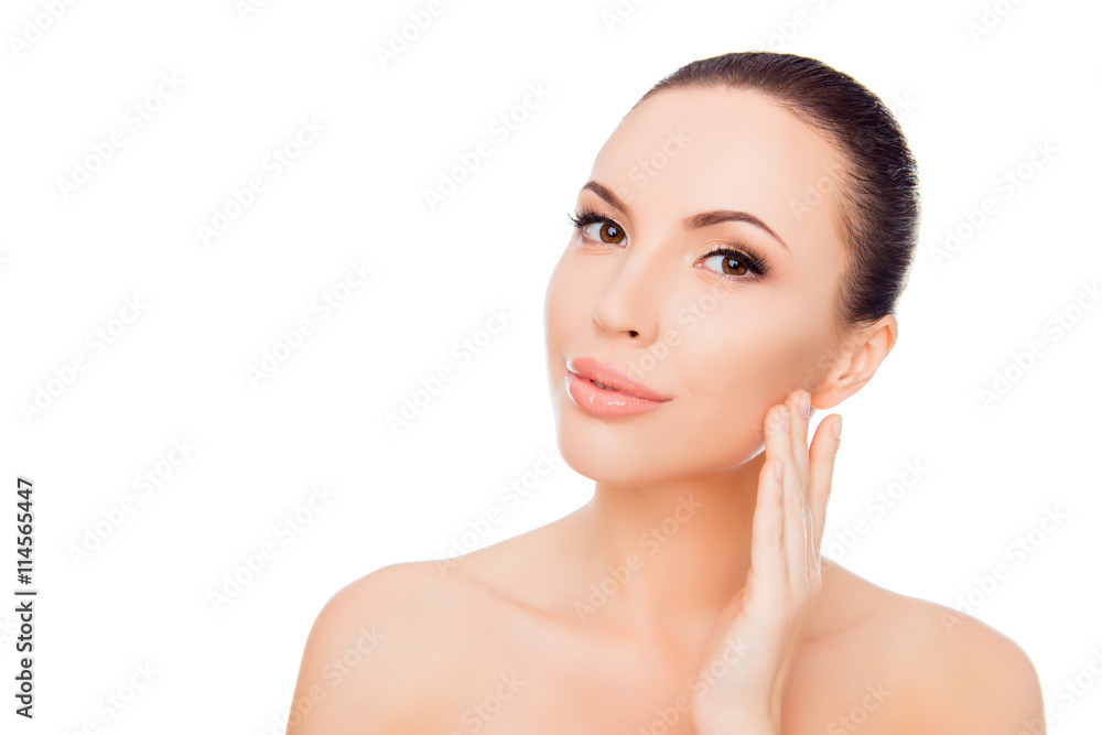 Attractive young woman applying cream for skin on her face Attractive young woman applying cream for skin on her face
