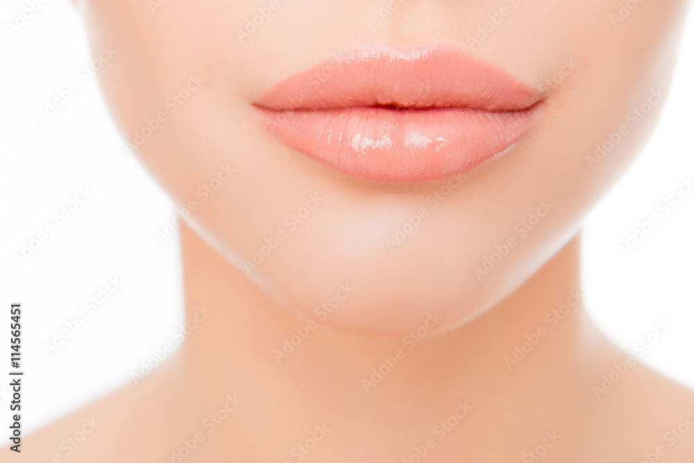 Close up photo of full woman's lips after augmentation Close up photo of full woman's lips after augmentation