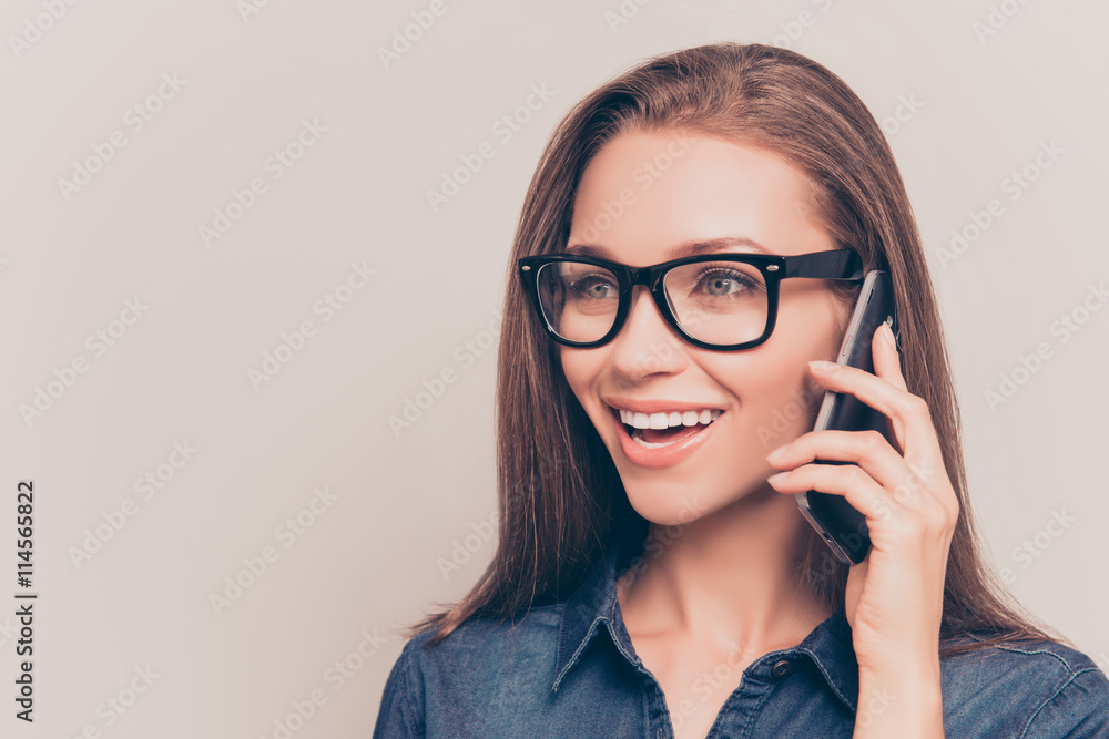 Portrait of beautiful woman in glasses talking on mobile phone Portrait of beautiful woman in glasses talking on mobile phone