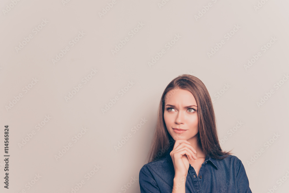 Young thoughtful pretty girl isolated on gray background Young thoughtful pretty girl isolated on gray background