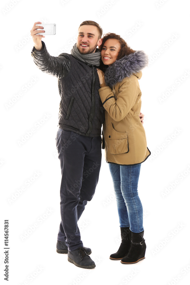 Young cheerful friends taking selfie isolated on white Young cheerful friends taking selfie isolated on white