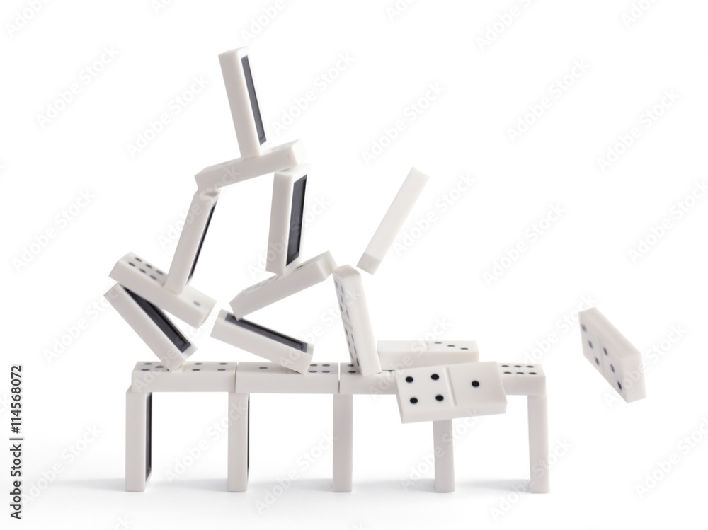 Falling tower of dominoes, isolated on white Falling tower of dominoes, isolated on white