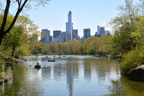 A reflective view of the NYC skyline from Central Park