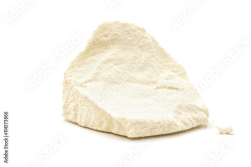 solid block of powdered milk on white