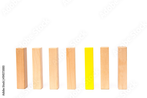 a line of wooden toy blocks on white background