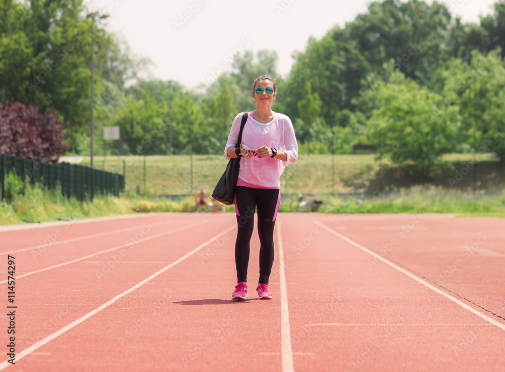 Athletic girl walking sport running tracks
