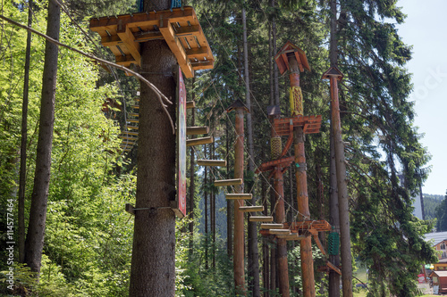 Climbing park, adventure playground in the trees