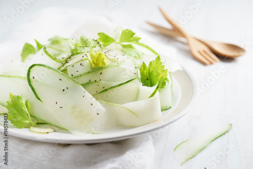 Salad of cucumber, chia seeds and parsley.
