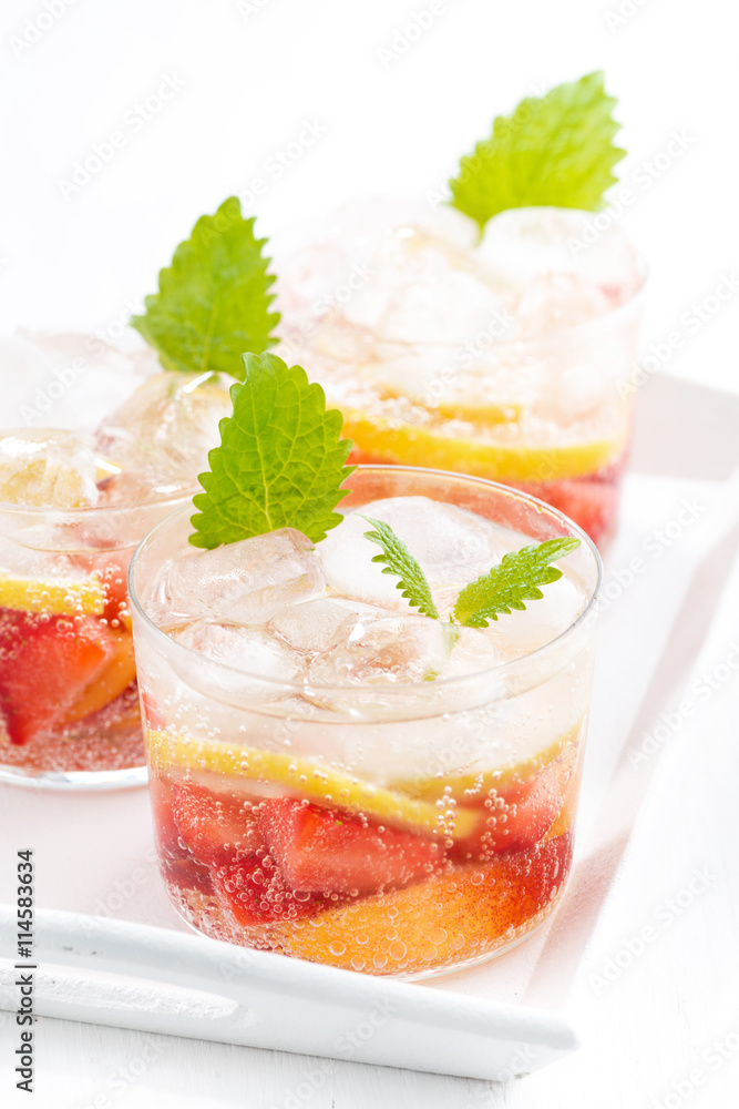 refreshing lemonade with strawberry and lemon on white tray refreshing lemonade with strawberry and lemon on white tray