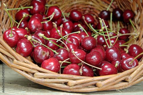 Ripe cherries in a wicker basket