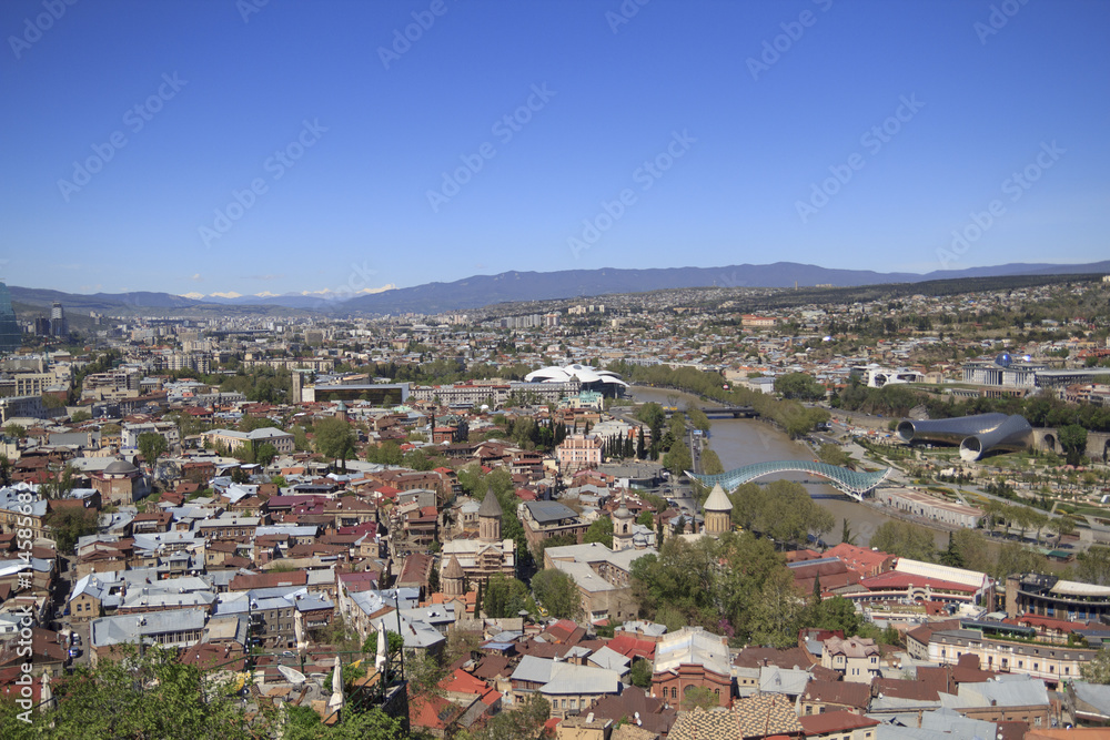 Tbilisi bird's-eye view with mountains on a background
