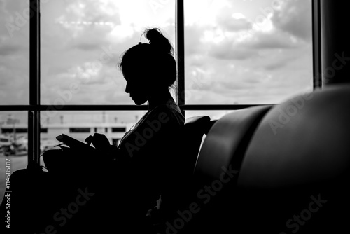 silhouette of Woman at airport in sunset