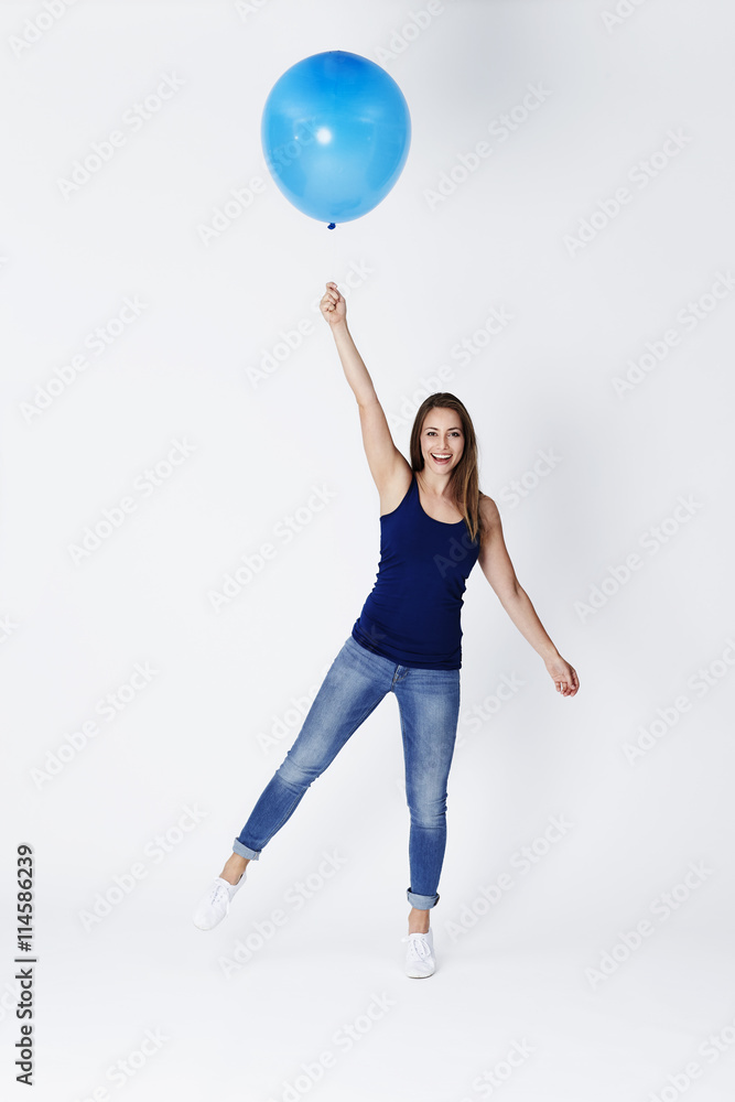 Balloon girl about to float away, portrait Balloon girl about to float away, portrait