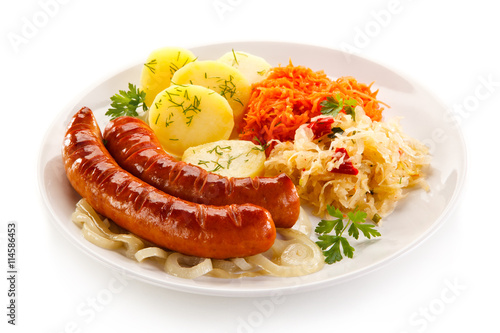 Quadro su tela Grilled sausages and vegetables