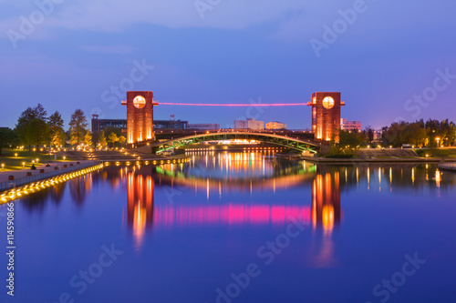 Beautiful architecture building and colorful bridge in twilight