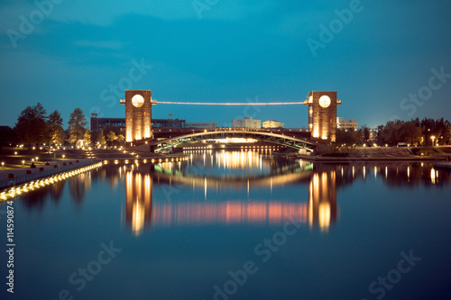 Beautiful architecture building and colorful bridge in twilight