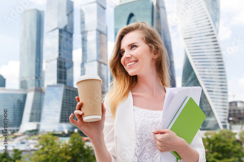 Young stylish woman drinking coffee