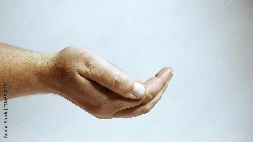 Silver coins falling to hand. Economic and financial theme. Money for you. Silver coins falling to hand. Economic and financial theme. Money for you.
