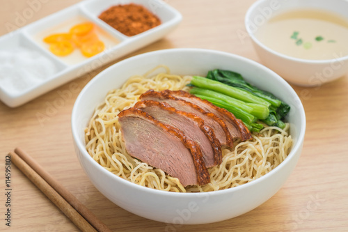 Canvas Print Roasted duck with noodles in bowl and soup