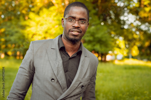 Young businessman in park