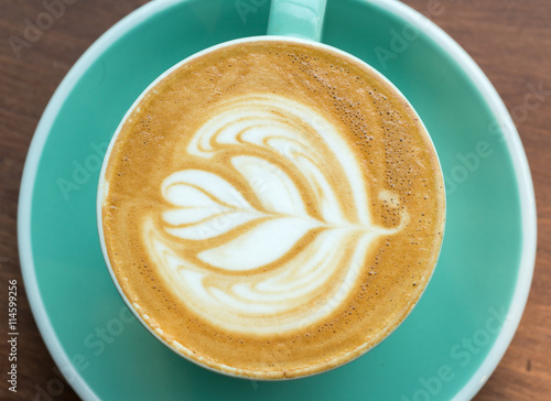 Top angle view of coffee cup on wood background 