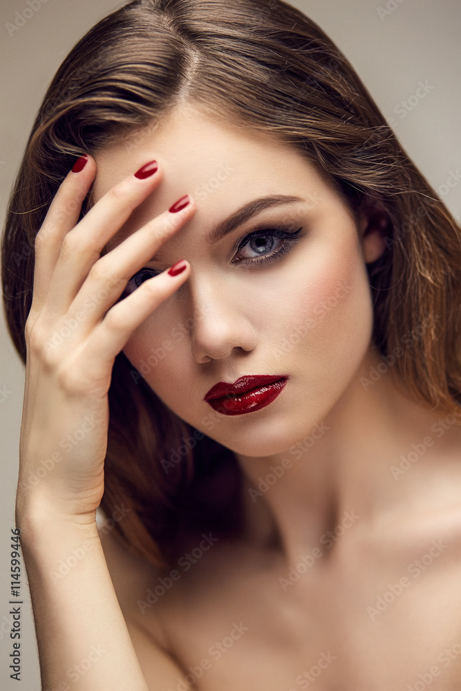 Classic red lips girl touching forehead Classic red lips girl touching forehead