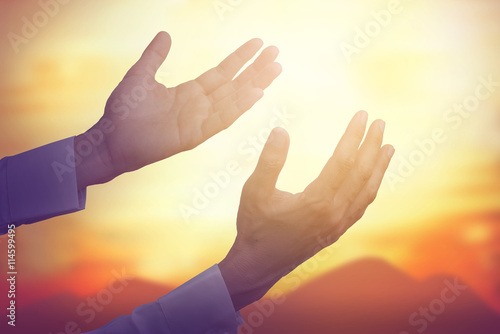 Hand of man pray for sky