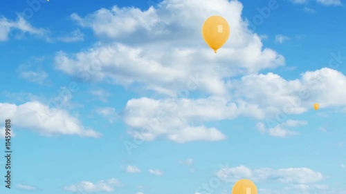 Volo palloncini gialli su cielo azzurro photo