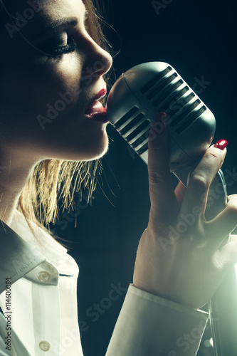 Canvas Print sexy woman with microphone