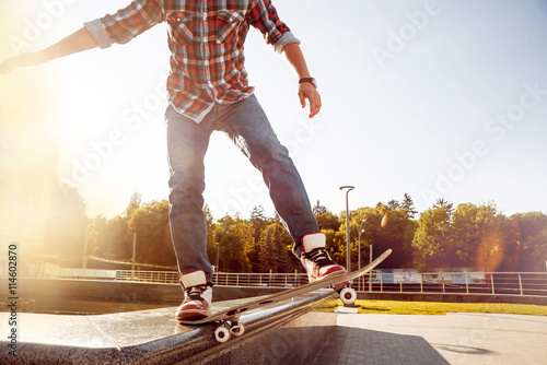 Fototapeta Naklejka Na Ścianę i Meble -  Young man riding a skateboard