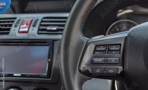 Button control on the steering wheel of the car © thanavut