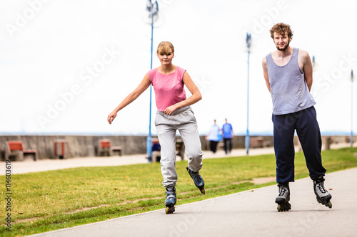 Принти на полотні Active young people friends rollerskating outdoor.