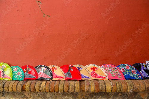 Fans Andalusian of colors on a red background