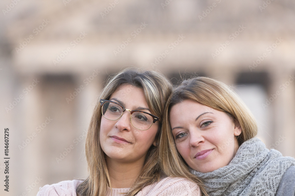 Portrait of two cute and blonde young women