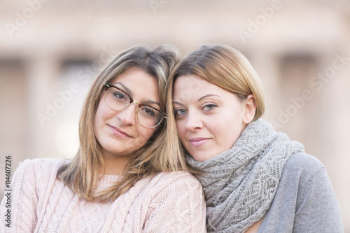 Portrait of two cute fake blonde girls