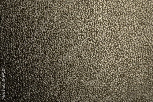 Closeup deep yellow leather texture for design. Leather background with copy space for text or image. © phanthit malisuwan